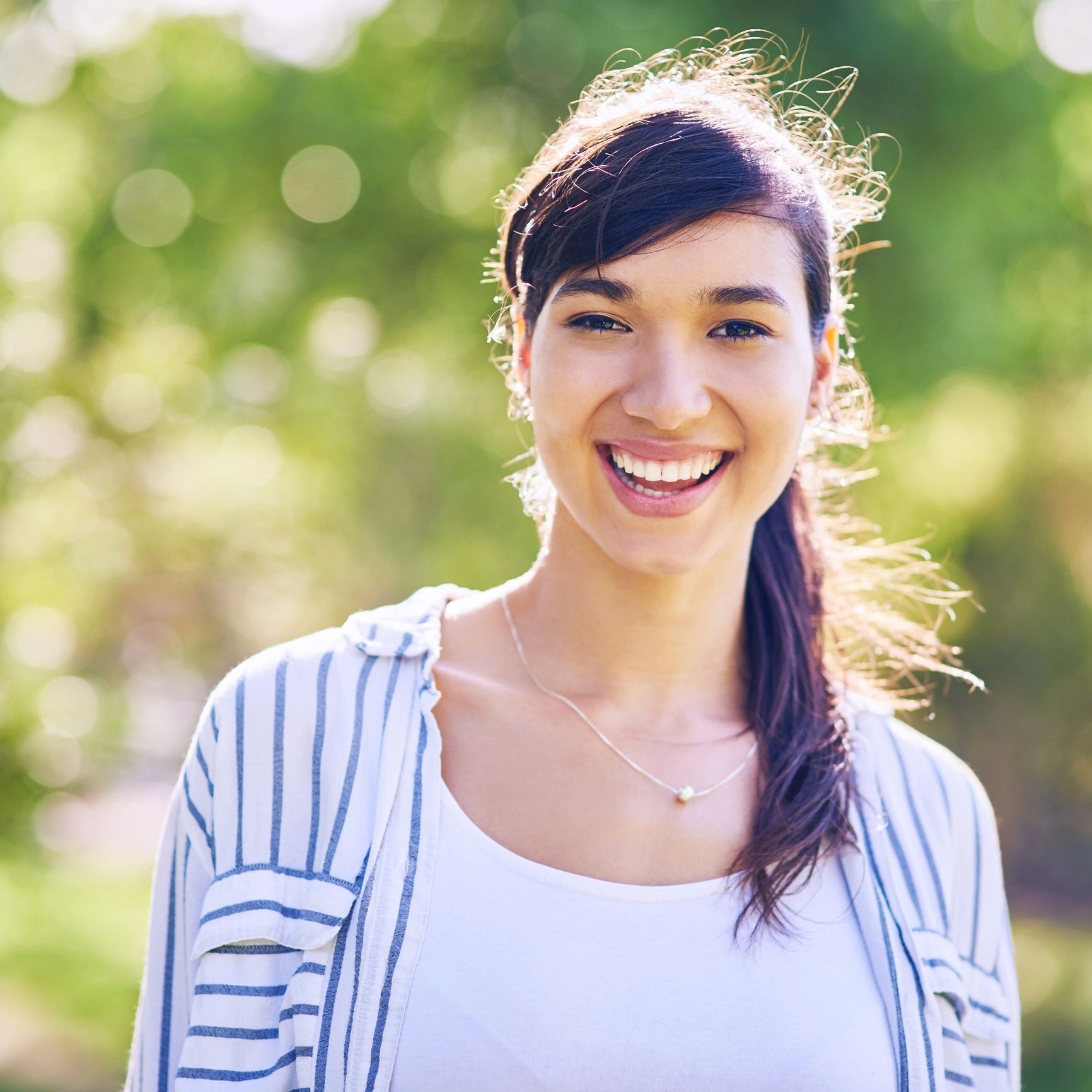 Portrait of a smiling woman outdoors